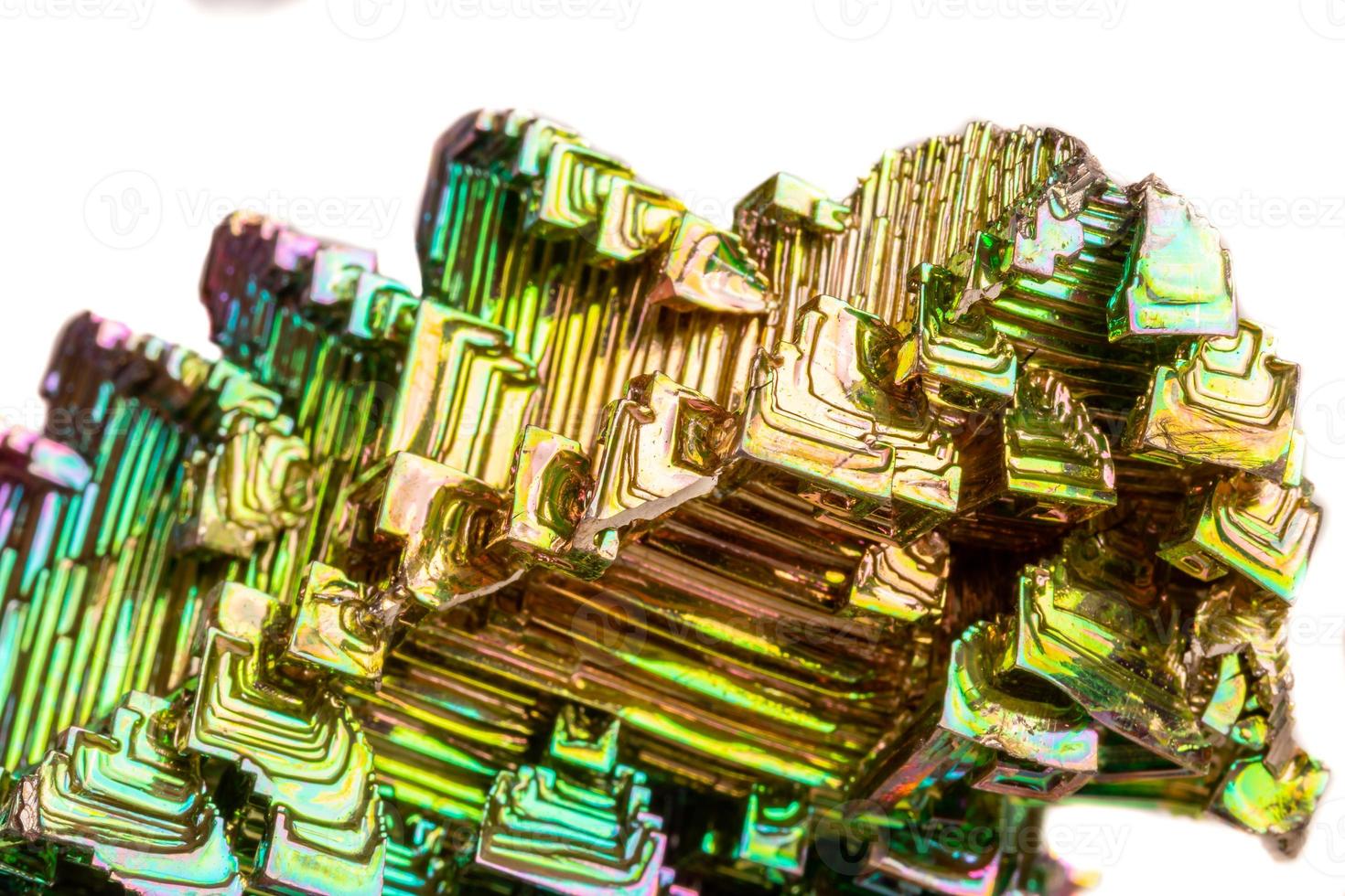 Macro of the mineral bismuth stone on a white background photo