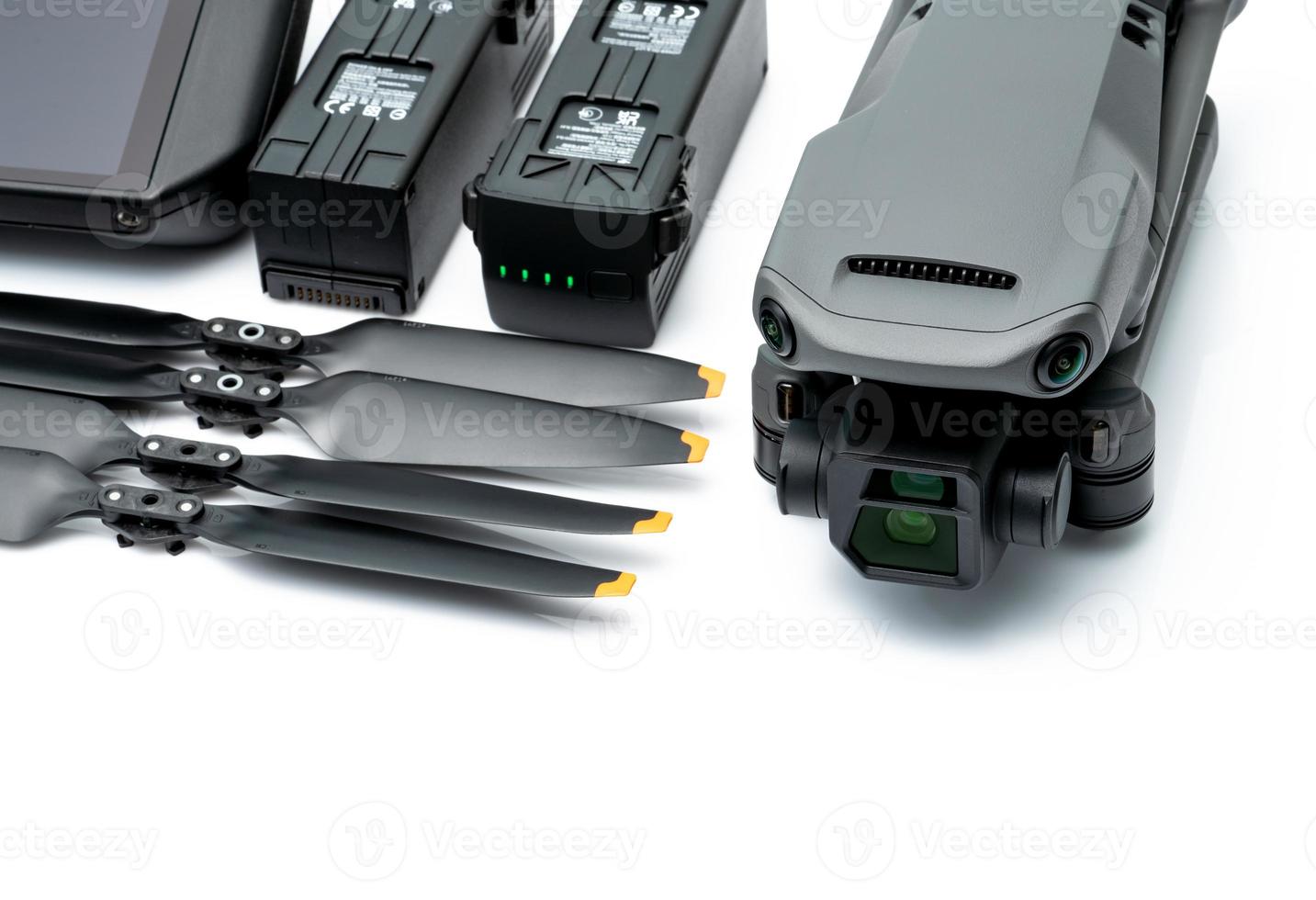 Drone and propeller blades on blur drone LiPo rechargeable battery. UAV or unmanned aerial vehicle. Quadcopter drone aircraft with a digital camera. Drone accessories. UAV carbon fiber propellers. photo