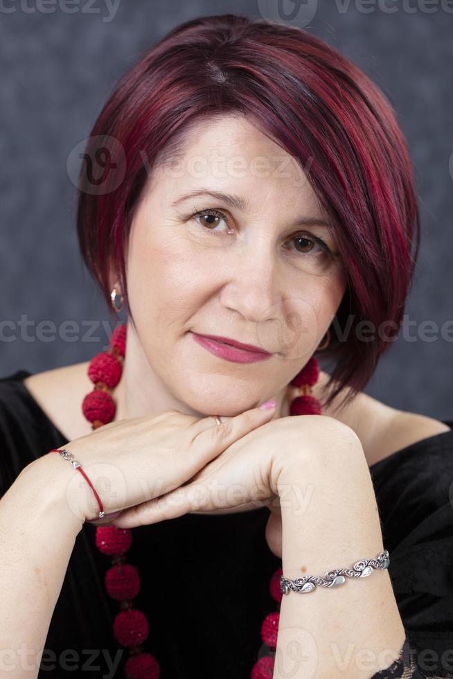 Portrait of a fifty year old woman. Beautiful mature woman. photo