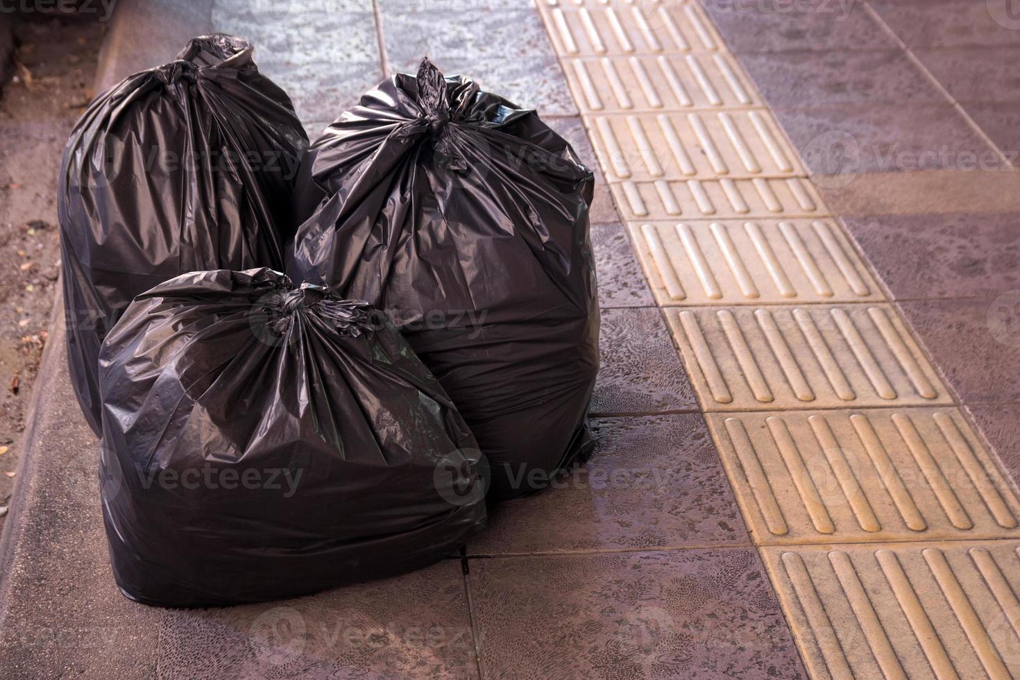 garbage bags on the walkway photo