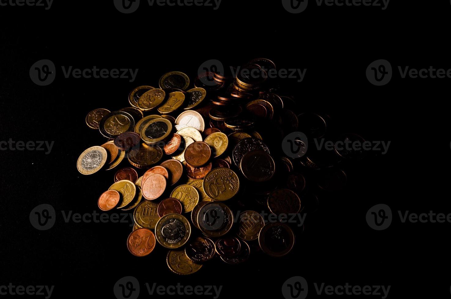 Coins on a black background photo