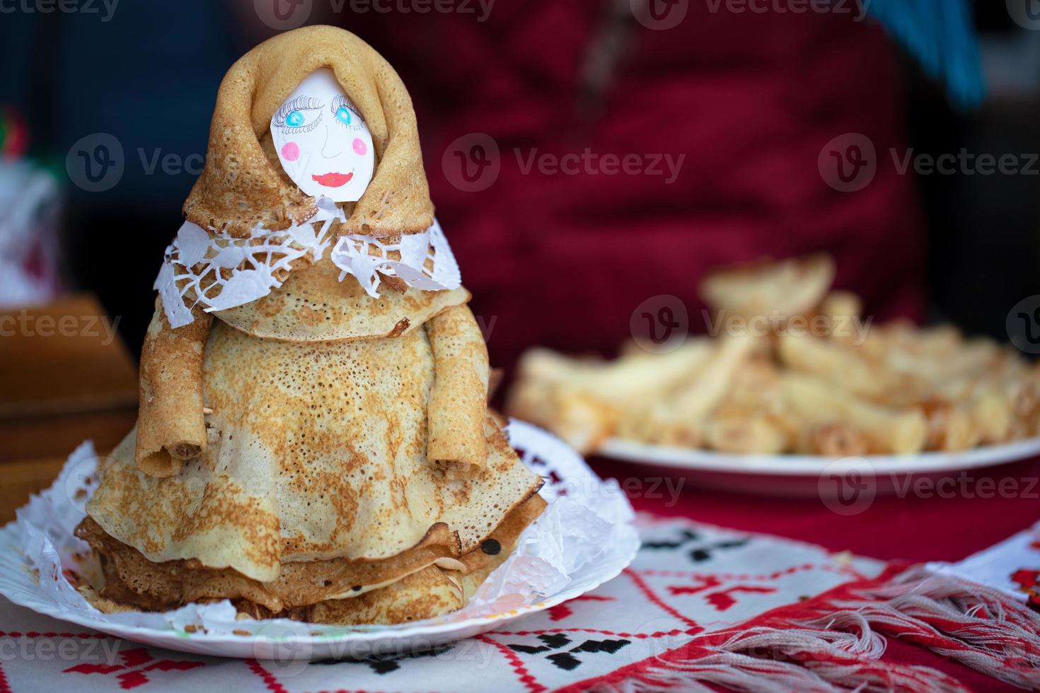 Maslenitsa holiday.Pancake doll. Doll baked from pancakes for the holiday Maslenitsa. photo