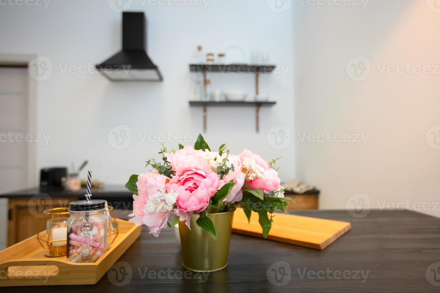 Kitchen table with flowers and a tray. Beautiful kitchen interior. photo