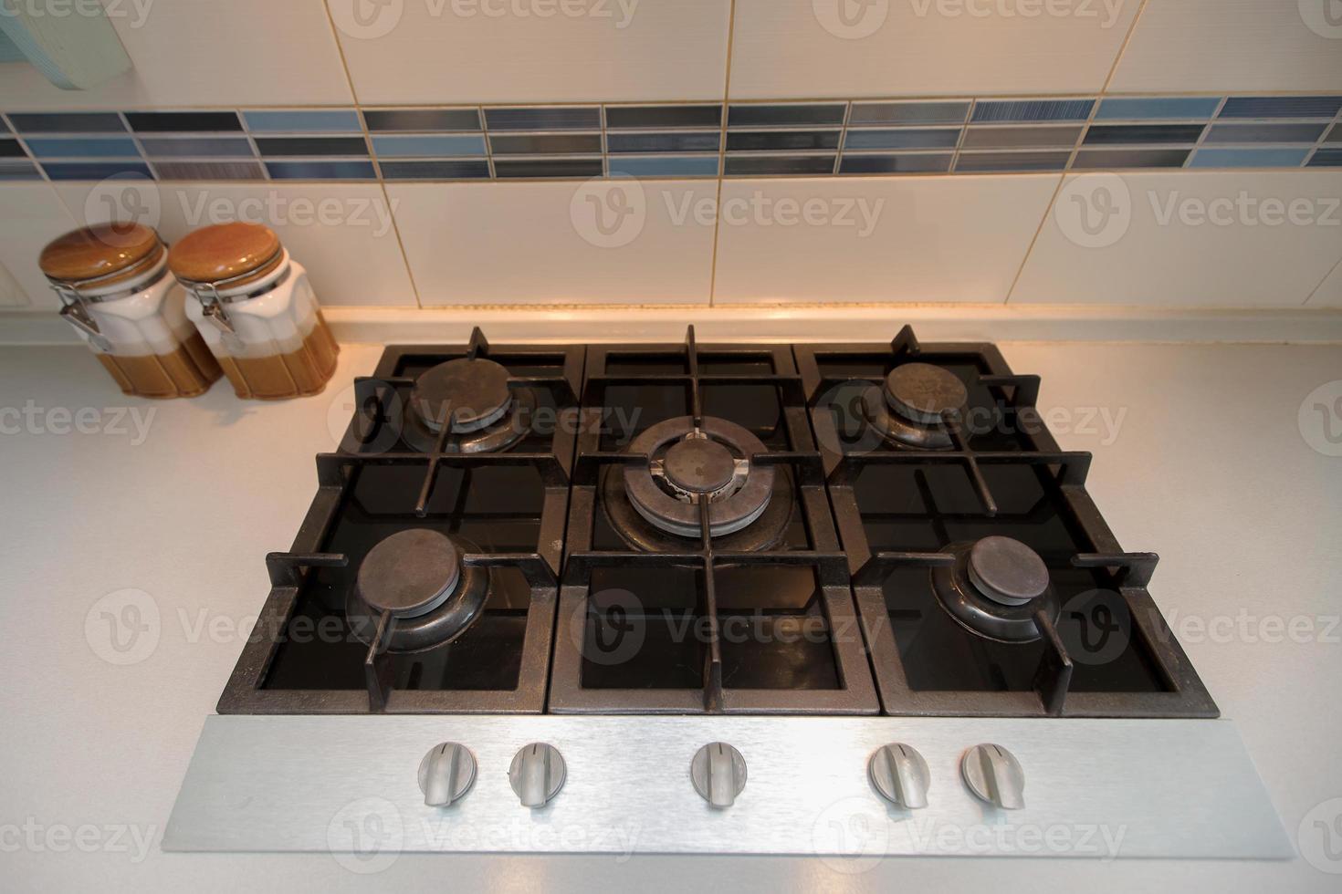 Gas panel built into the kitchen. Six-burner stove photo