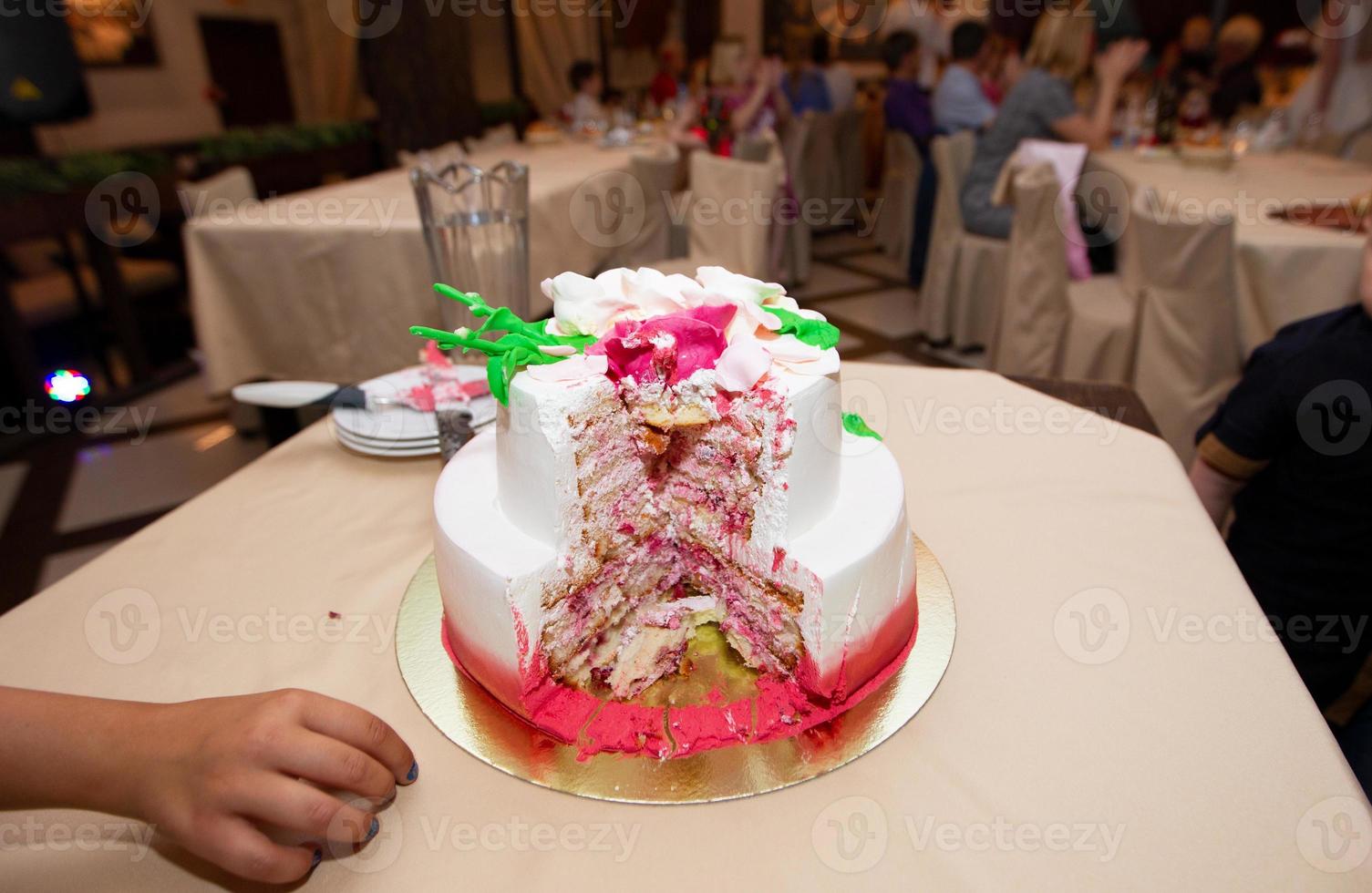 Beautiful cut cake on a restaurant background. photo