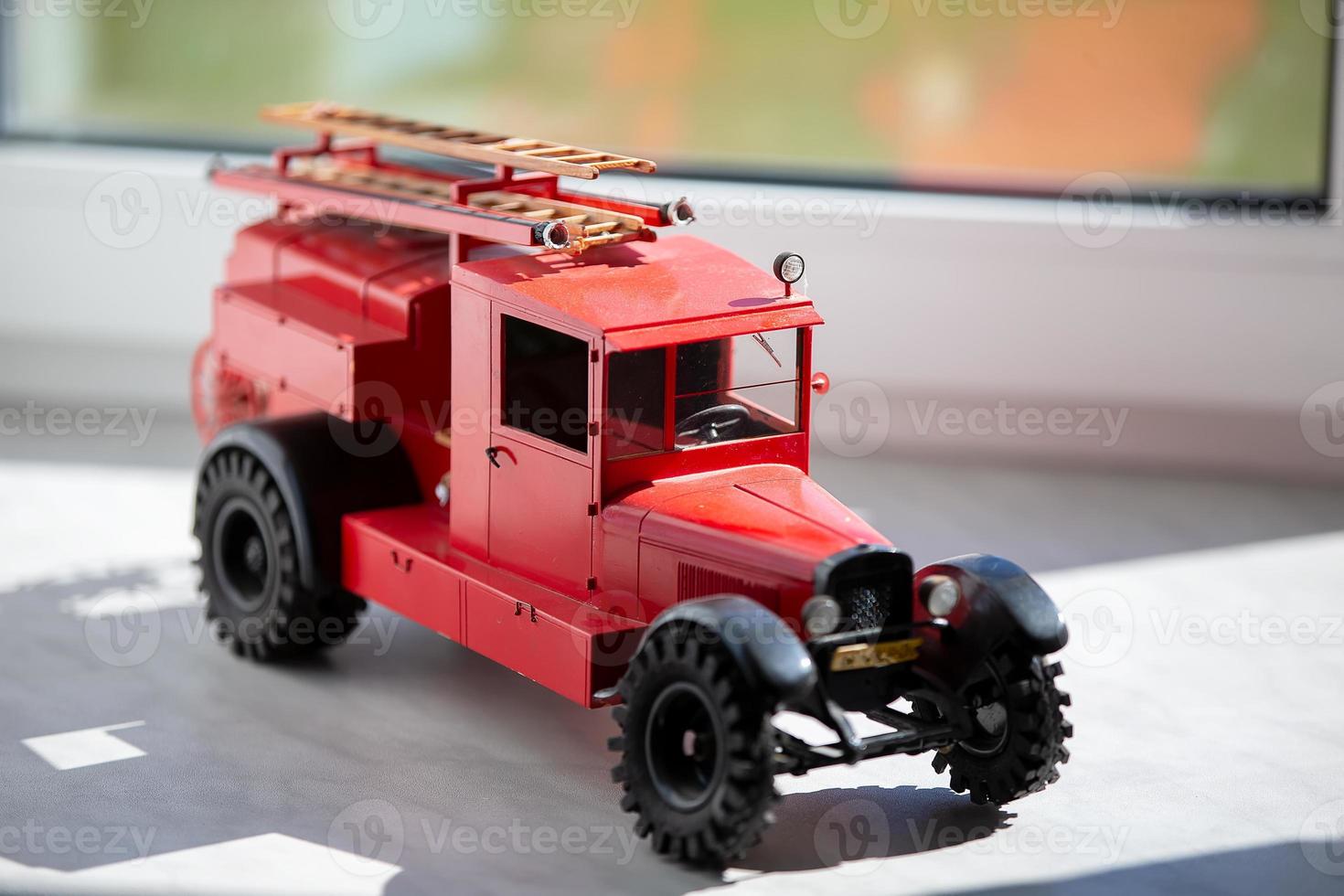 Toy retro fire truck of red color. photo