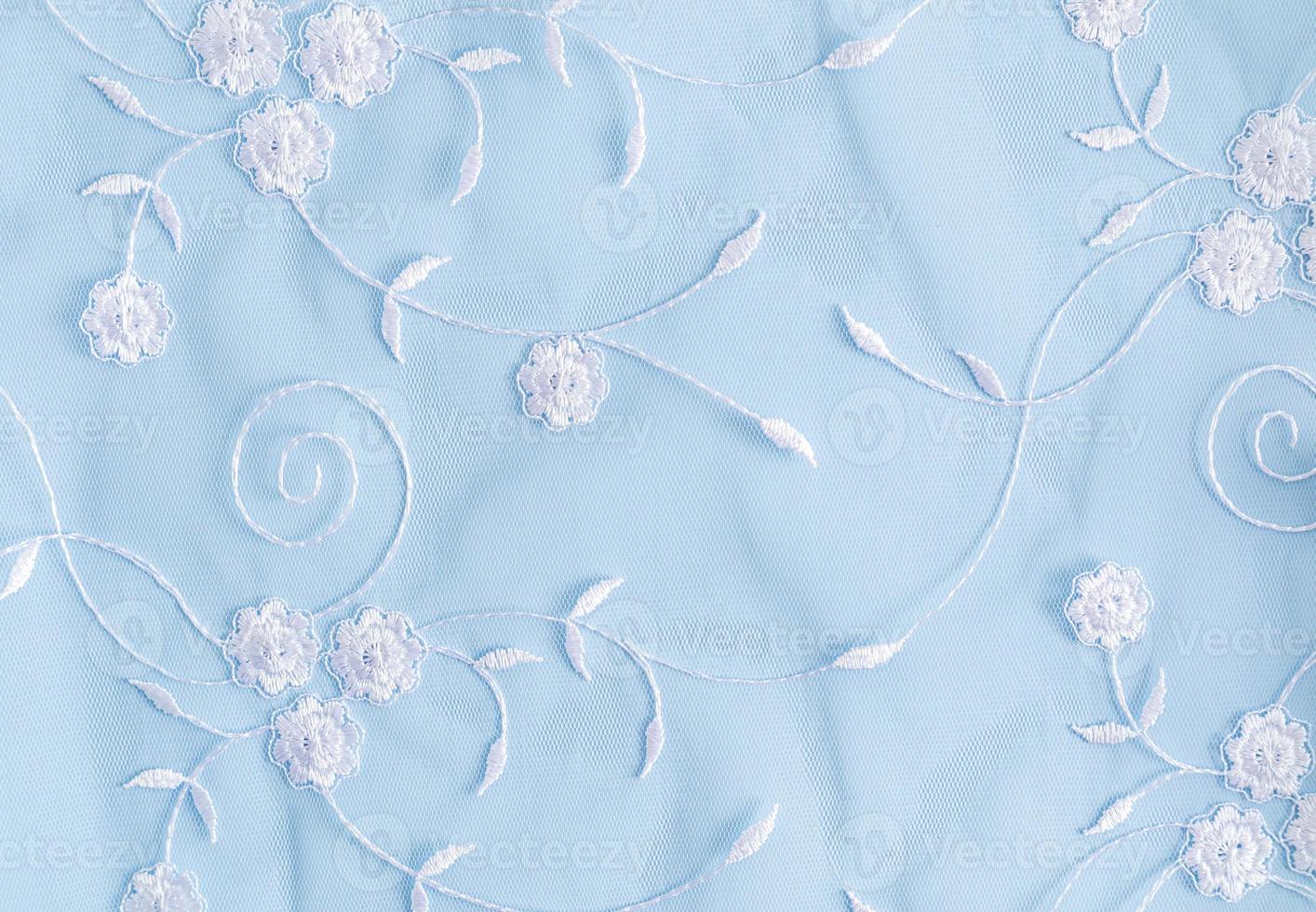 delicado azul textil antecedentes con blanco colores. cordón antecedentes. foto
