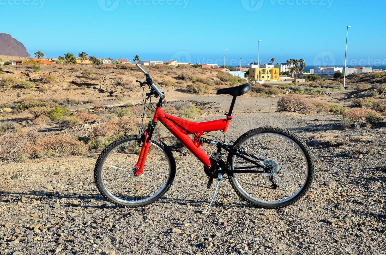 Red bicycle on the road photo