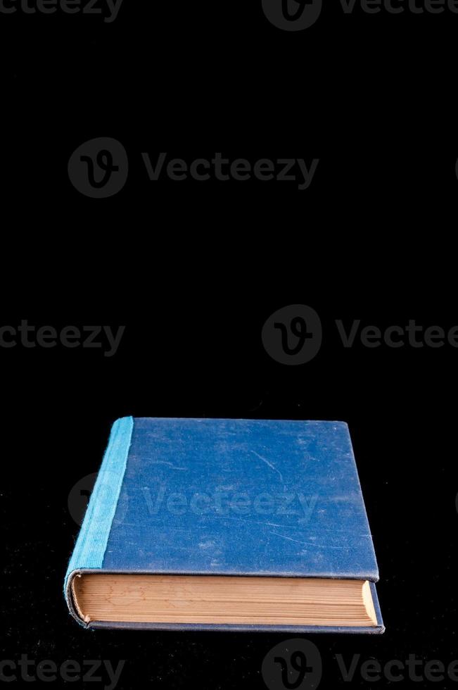 Book isolated on black background photo