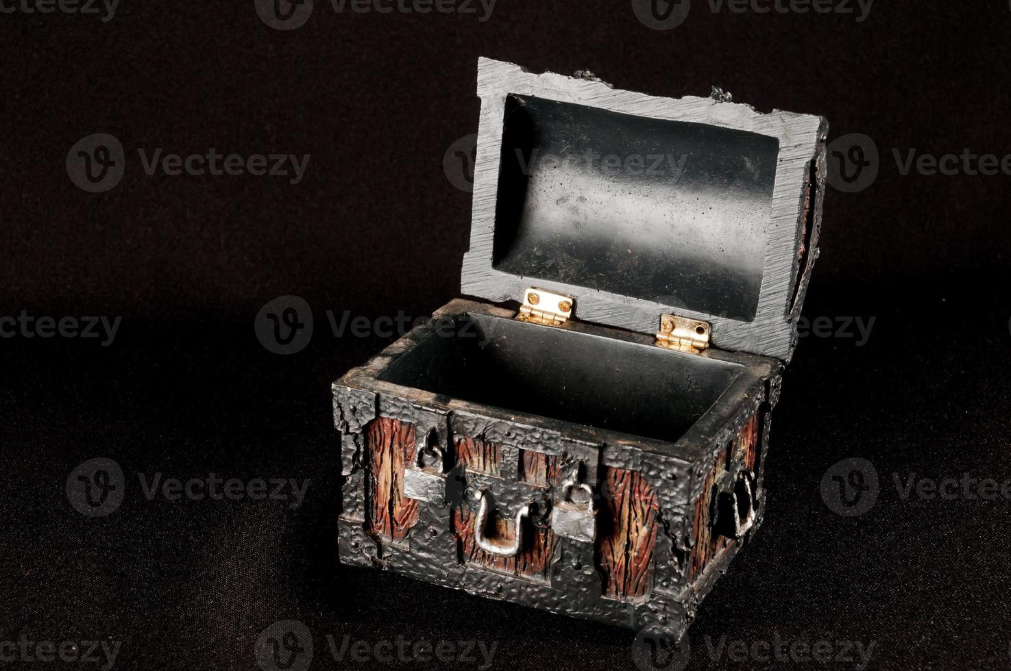 Wooden box isolated on black background photo