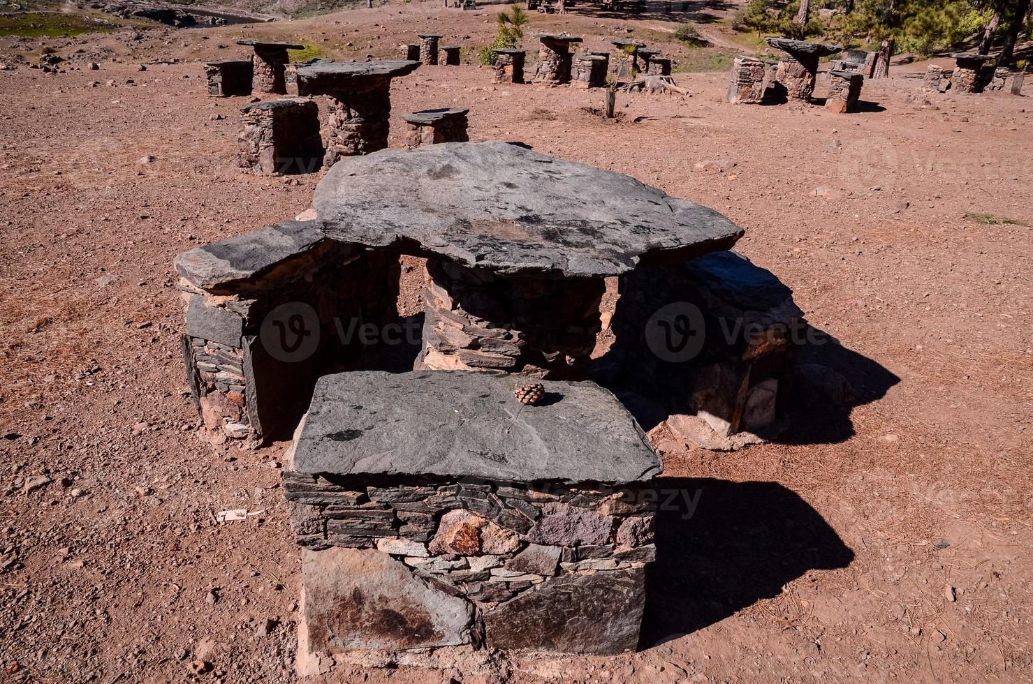 Stone tables and chairs at the picnic area photo