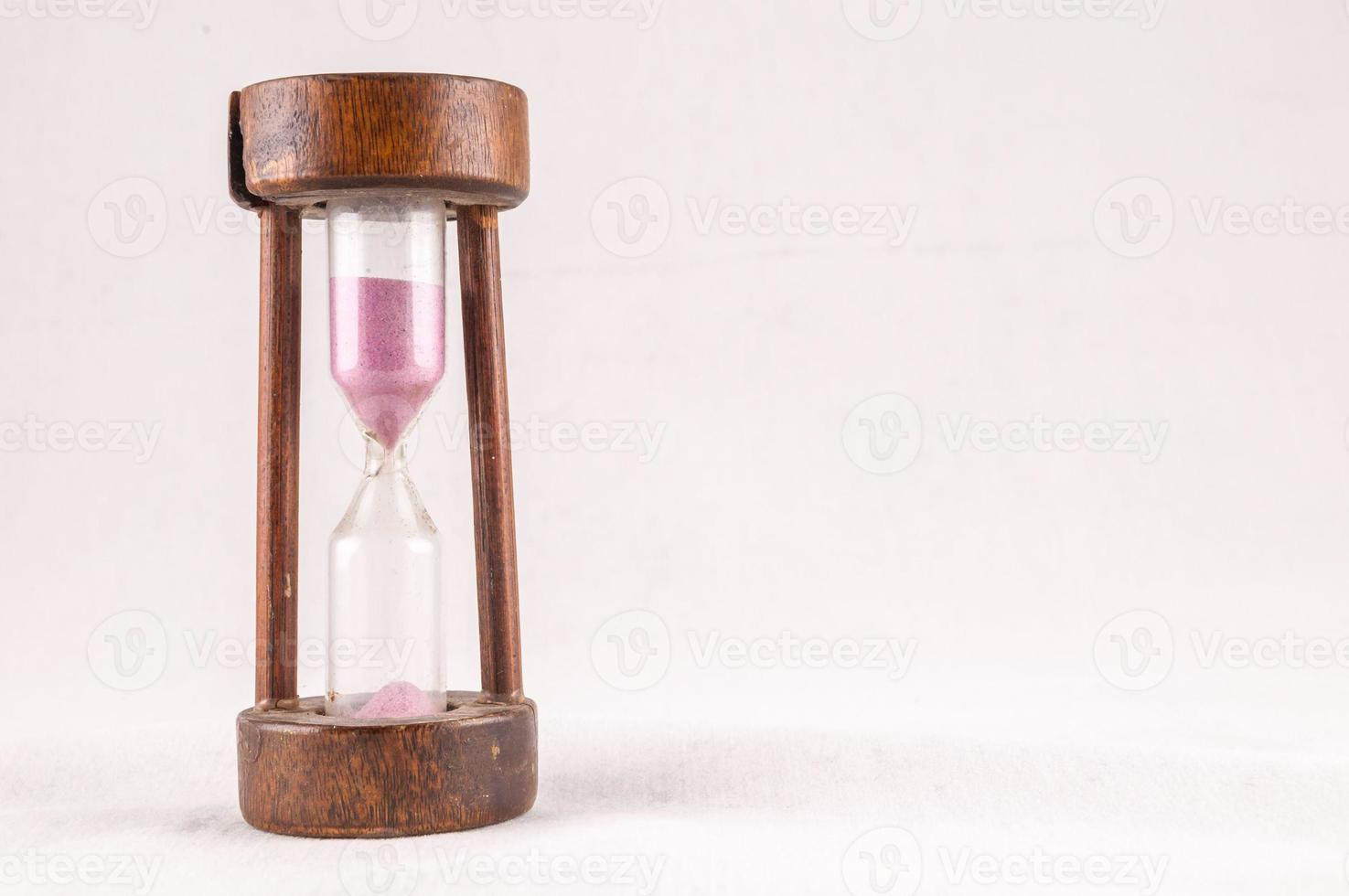 Hourglass on white background photo