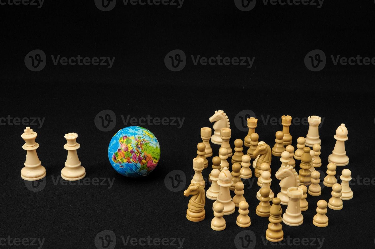 Chess pieces isolated on black background photo