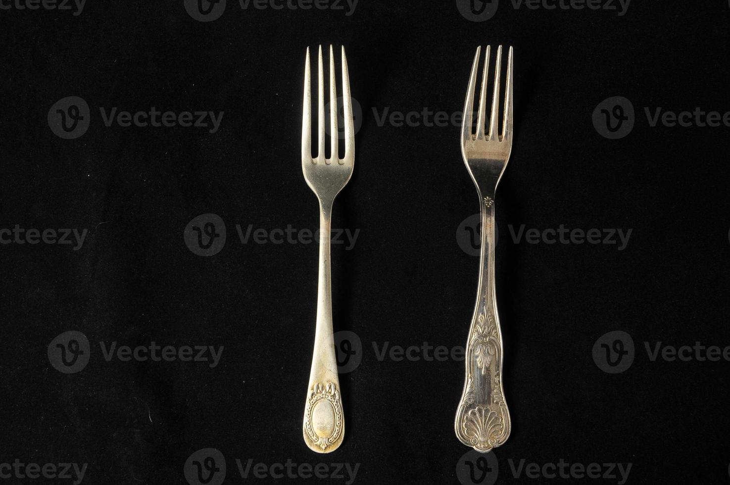 Forks on dark background photo