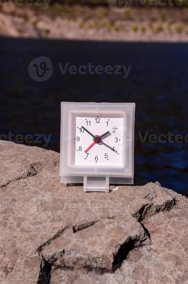 Clock on a rock photo