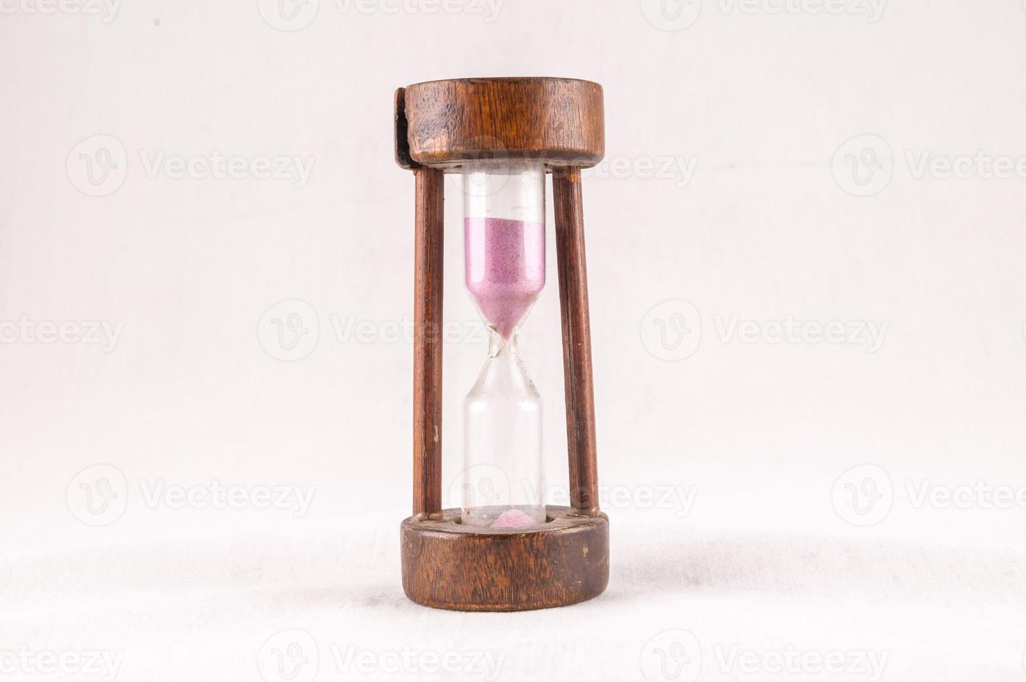 Hourglass on white background photo