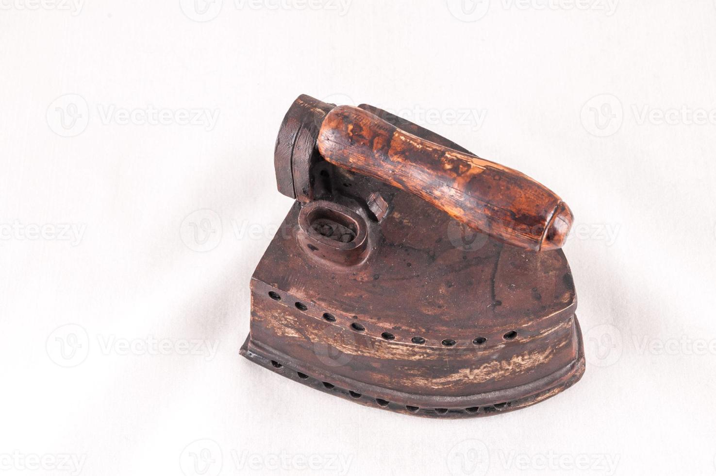 Vintage iron on white background photo