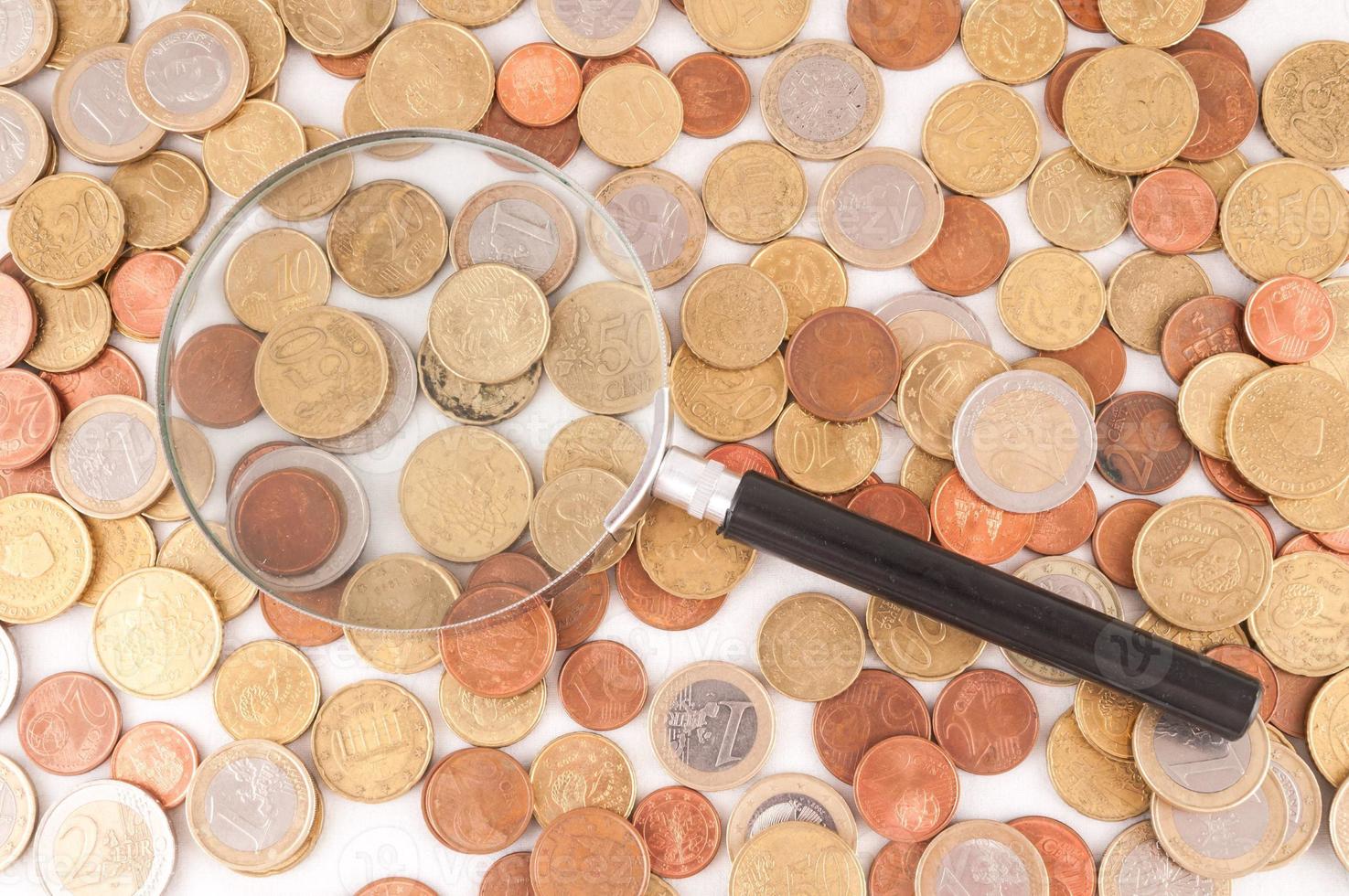 Loupe and coins photo