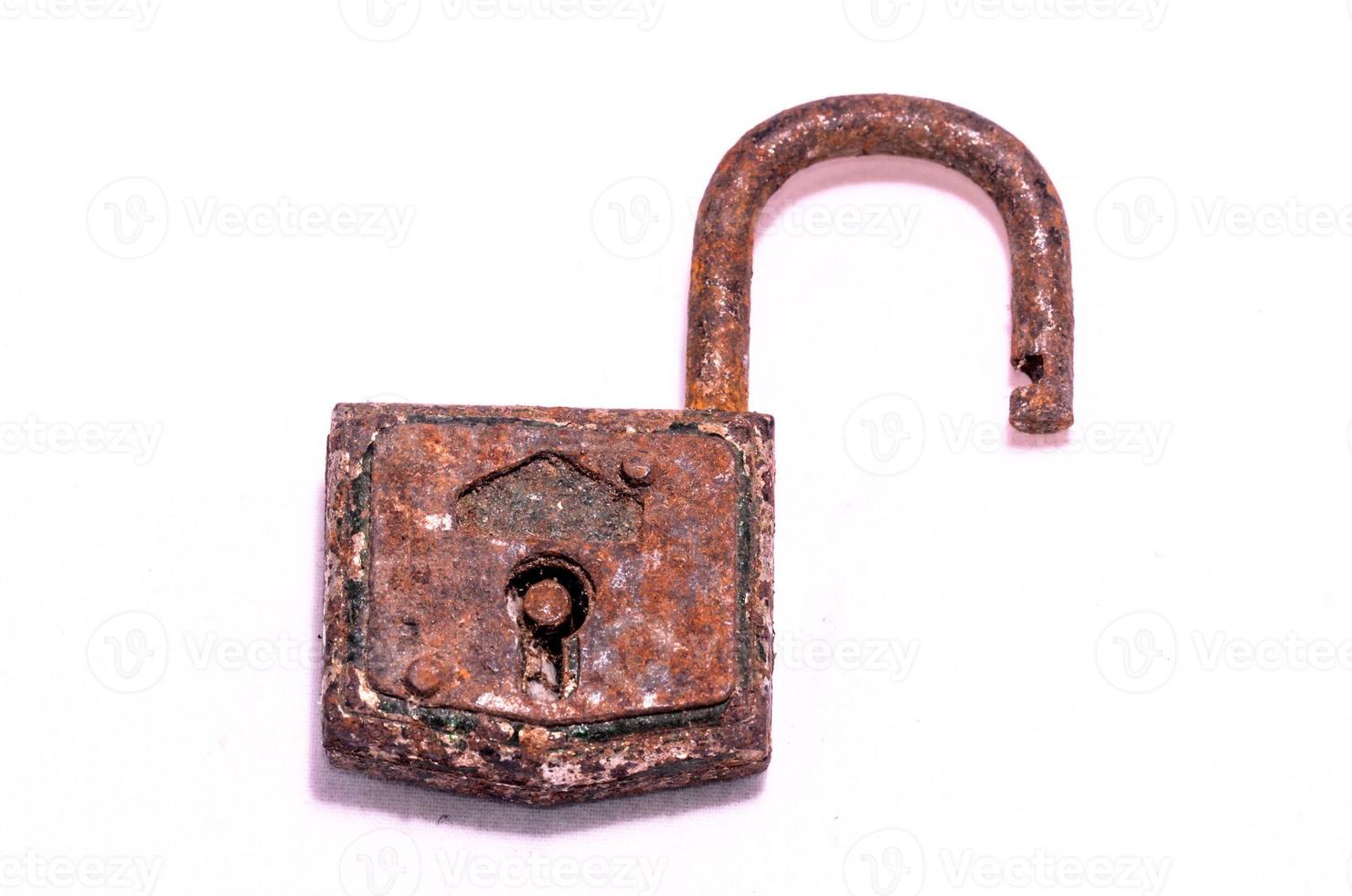 Rusted padlock on white background photo