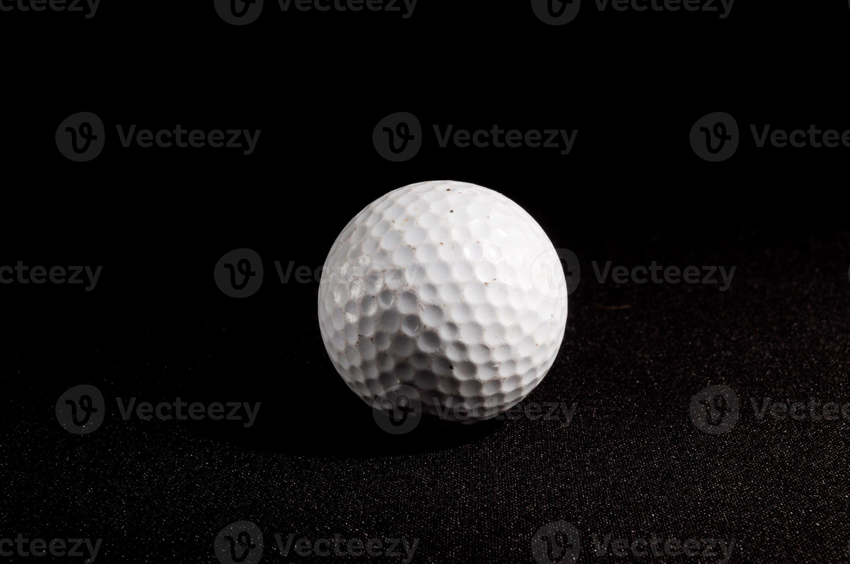 Golf ball on black background 22131833 Stock Photo at Vecteezy