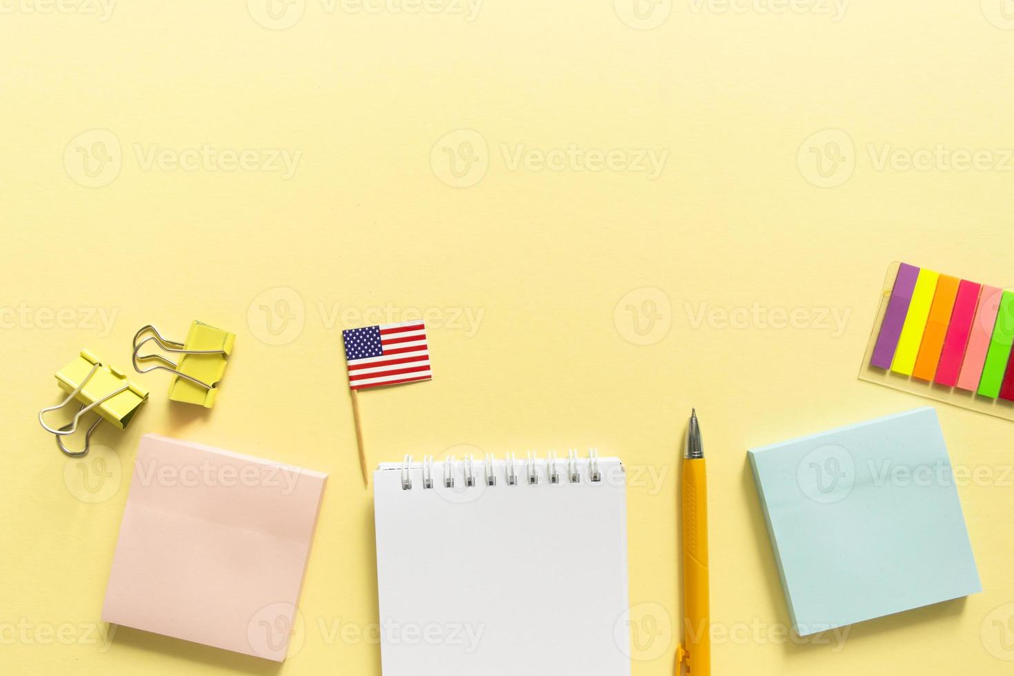 Back to school background. School accessories on a yellow background. photo