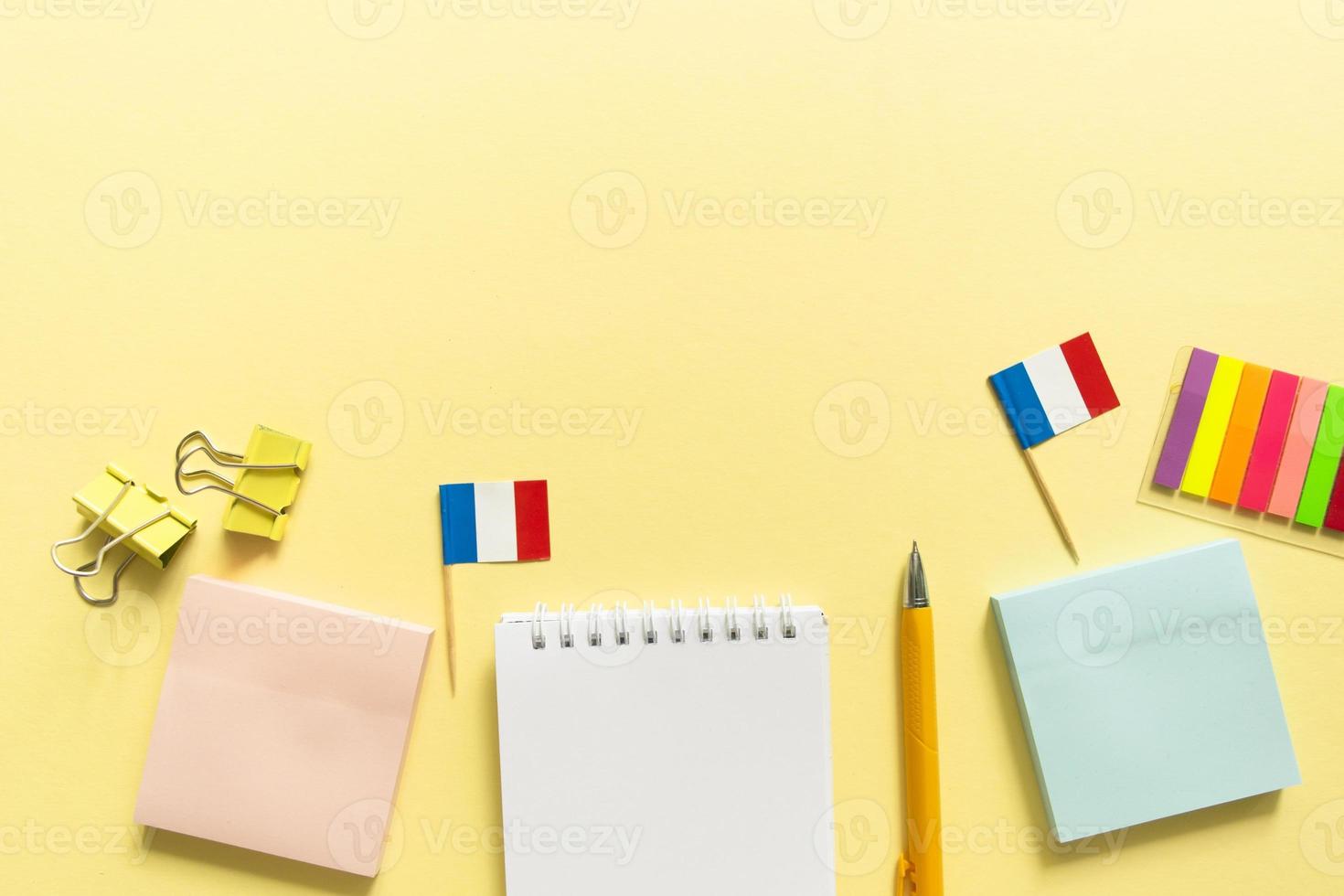 Back to school background. School accessories on a yellow background. photo