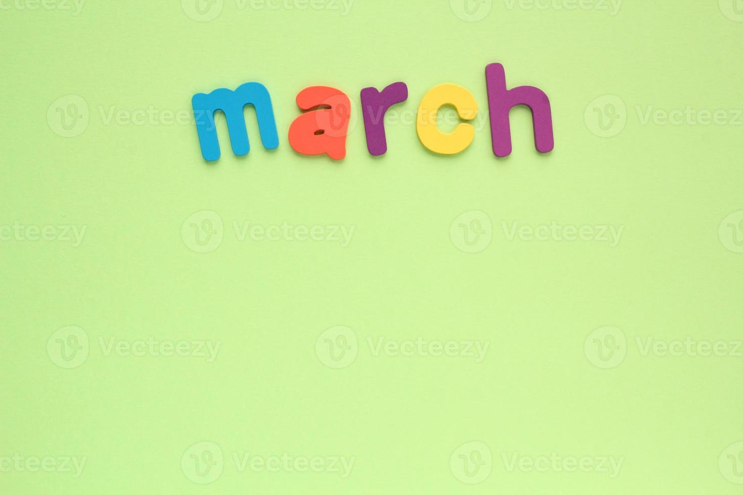 Calendar march list, daily planner for wall and desk on green background. To do, check list. Organizer, notebook with copy space. Business concept. Plan, action text. Schedule for month photo