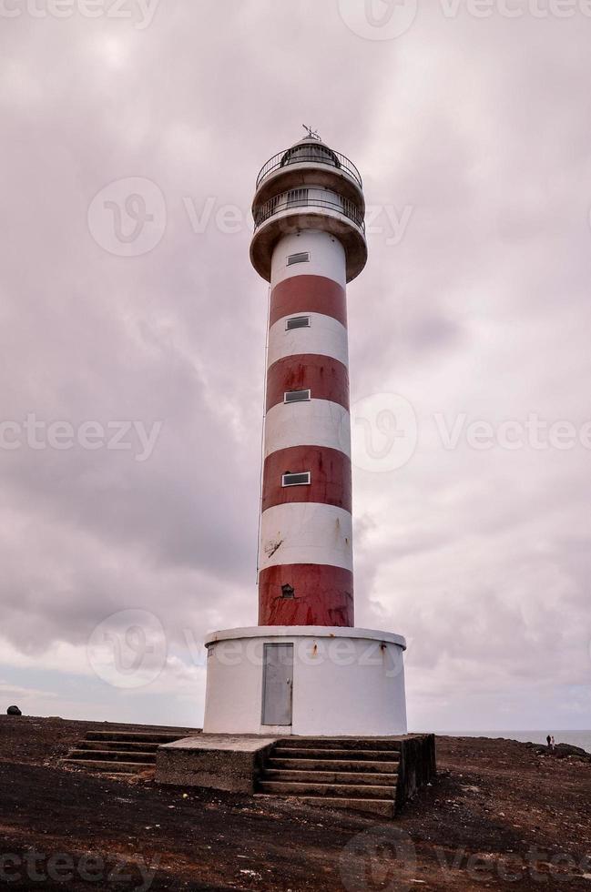 White and red lighthouse photo