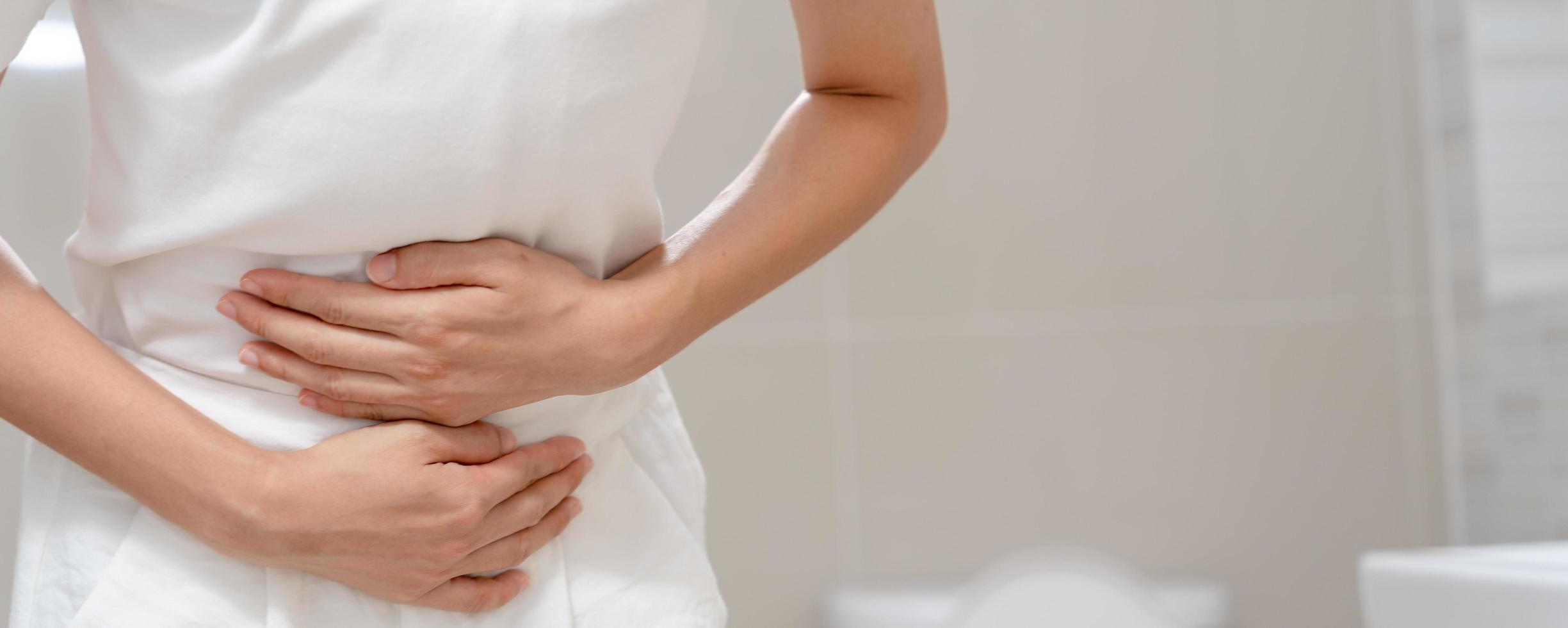 Constipation and diarrhea in bathroom. Hurt woman touch belly  stomach ache painful. colon inflammation problem, toxic food, abdominal pain, abdomen, constipated in toilet, stomachache, Hygiene photo