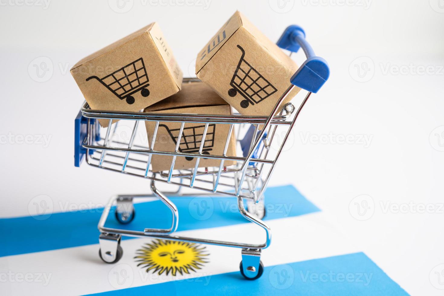 Box with shopping online cart logo and Argentina flag, Import Export Shopping online or commerce finance delivery service store product shipping, trade, supplier concept. photo