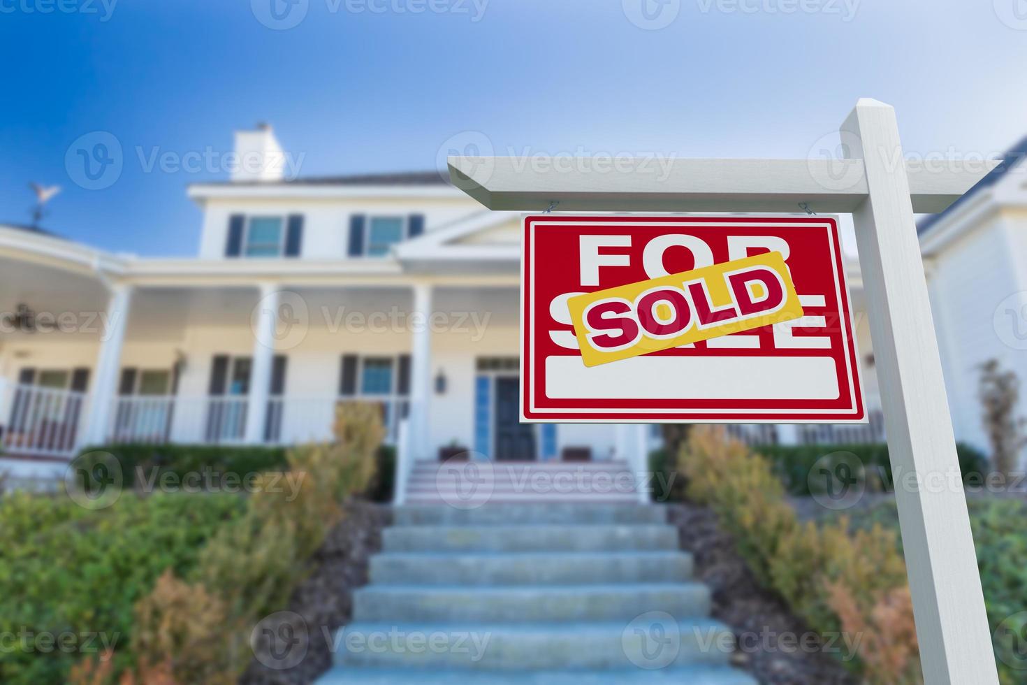 Sold For Sale Real Estate Sign in Front of New House. photo