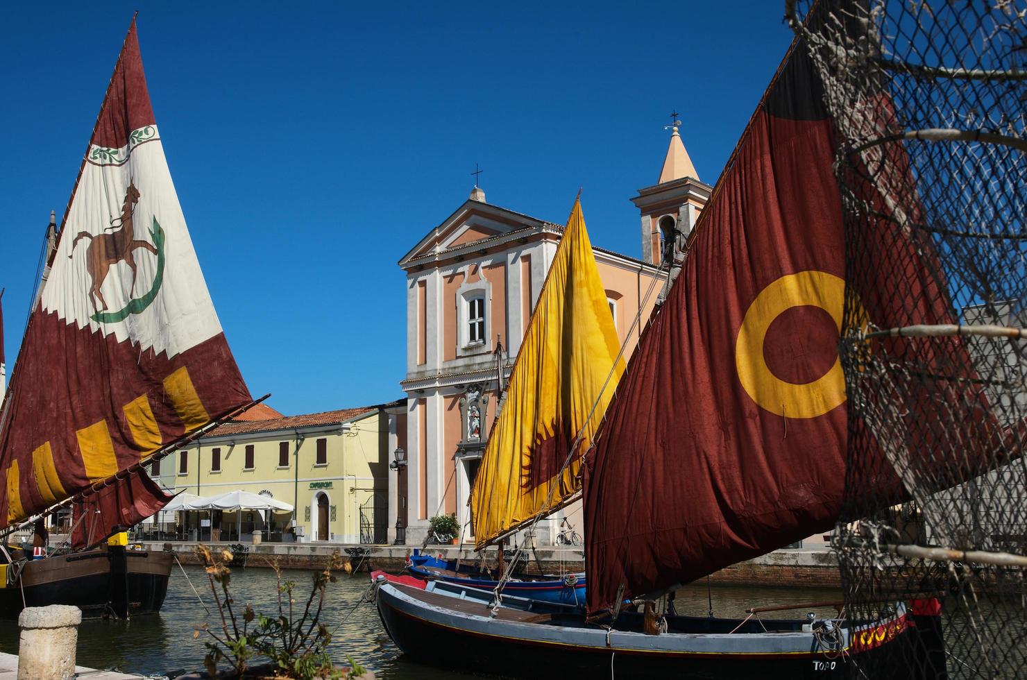 Cesenatico, Forli province, Italy July 30, 2022. On display along Cesenatico's canal port are these ancient sailboats once used by sailors for sea fishing. photo