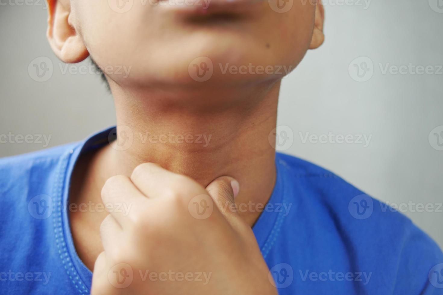 unrecognized man suffering throat pain close up photo