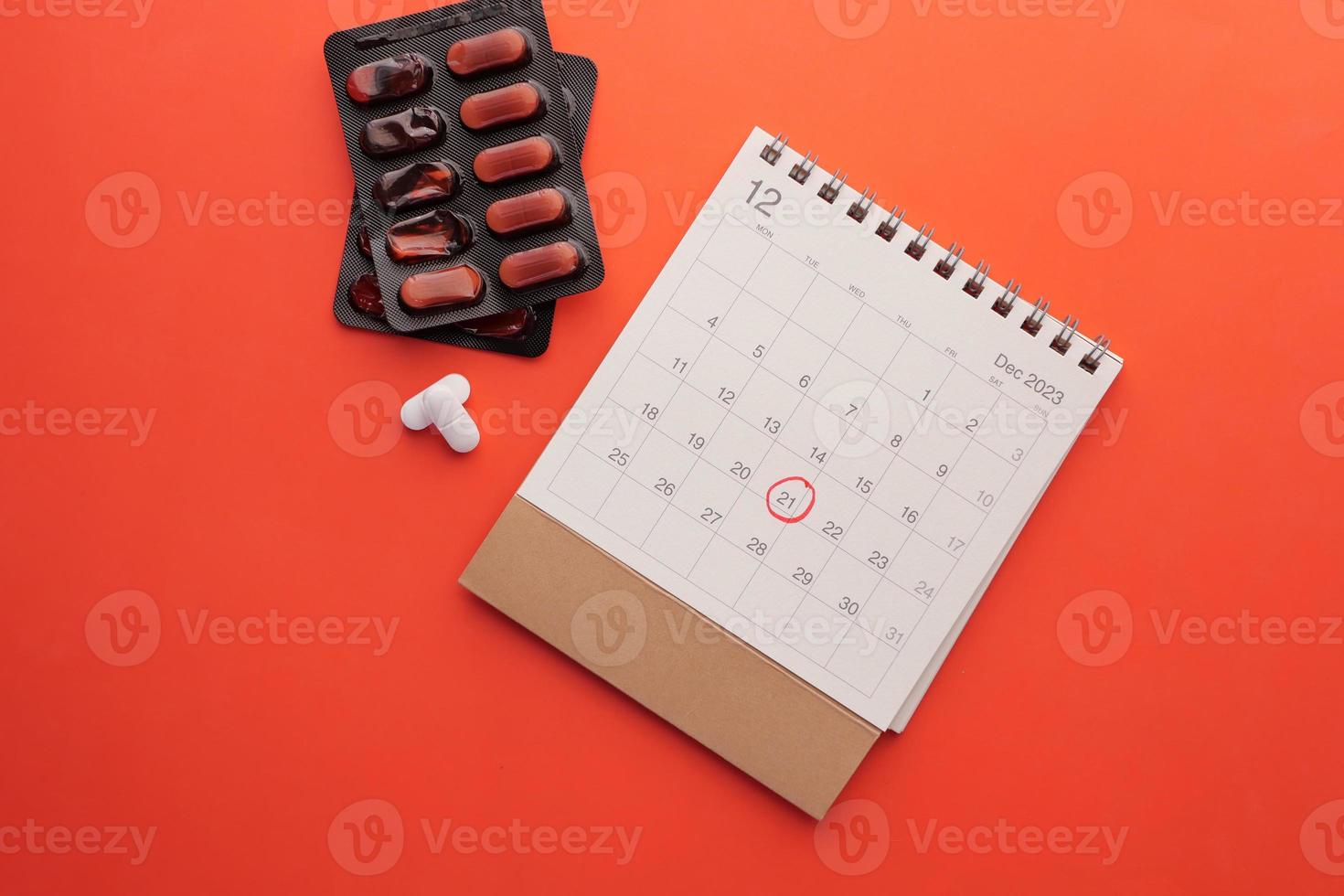 top view of medical pills and calendar , photo