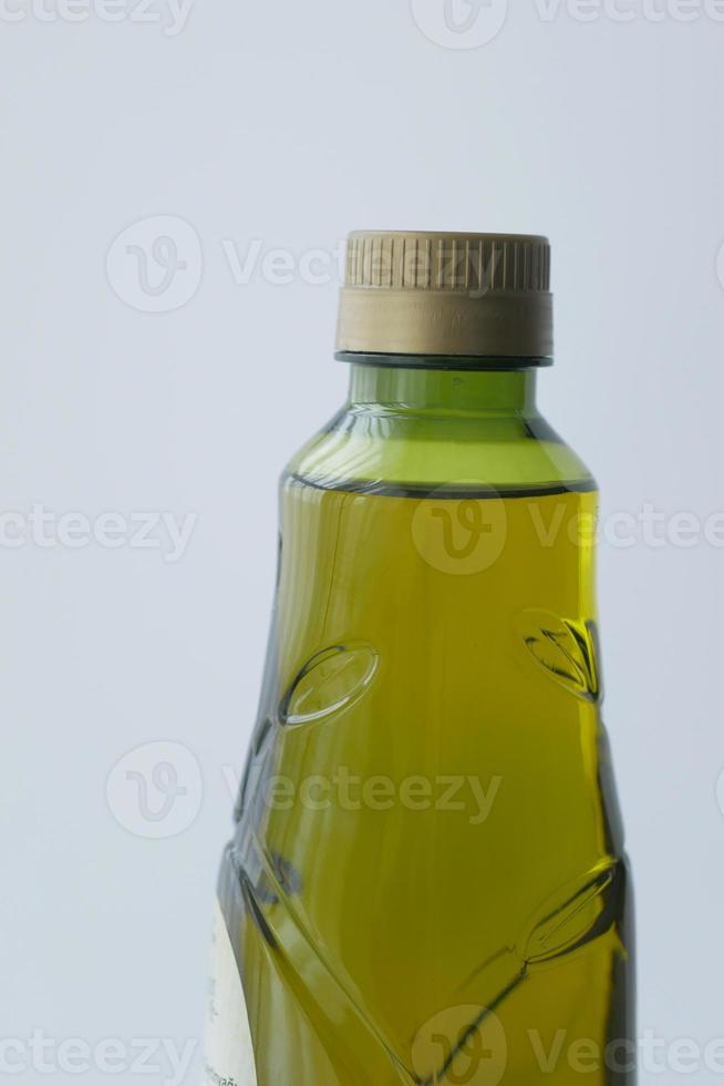 a bottle of olive oil on white background photo