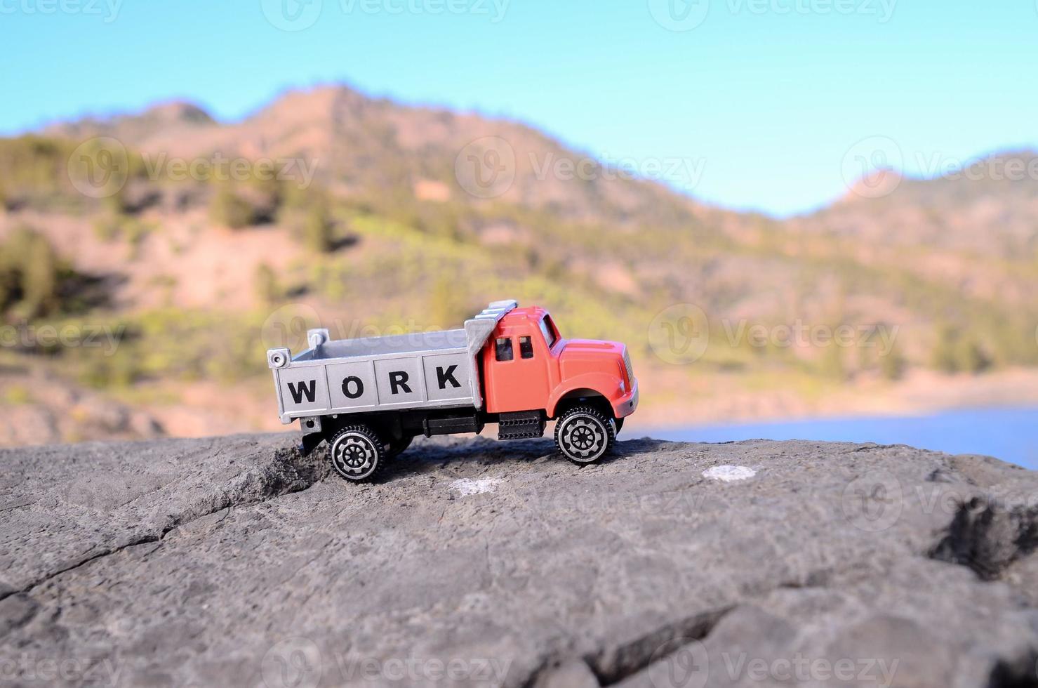 Toy truck on a rock photo