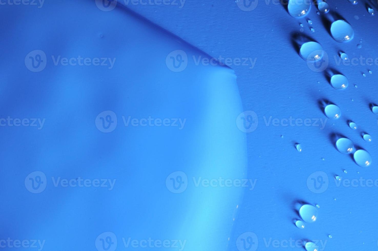 Blue background with water droplets photo