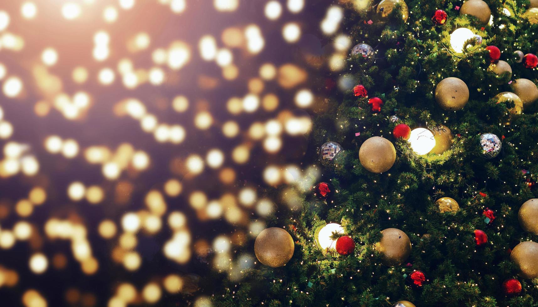decorate christmas tree on blur background photo