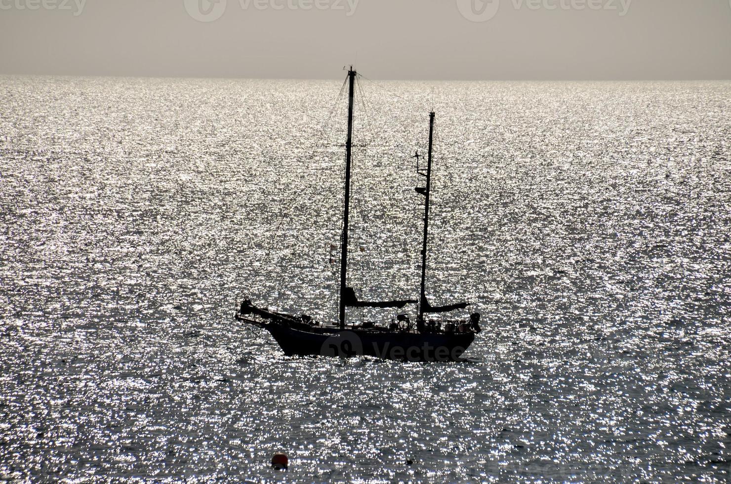 A boat floating on the sea photo