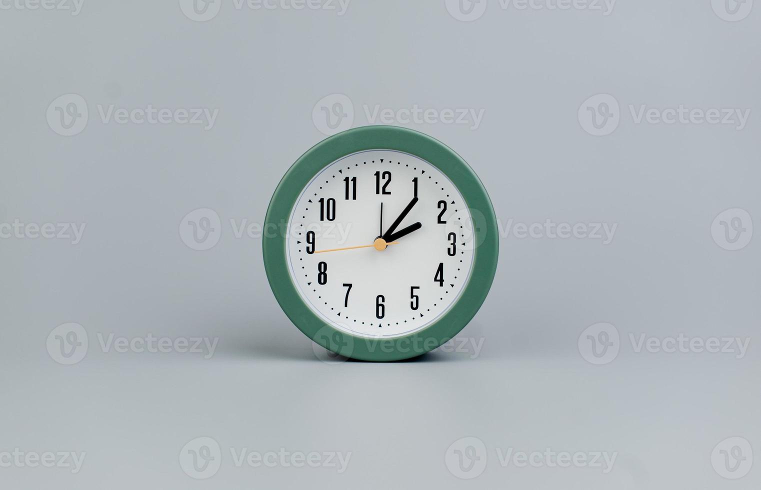 Alarm clock on gray scene, time concept operation of time When it's important to work and live photo