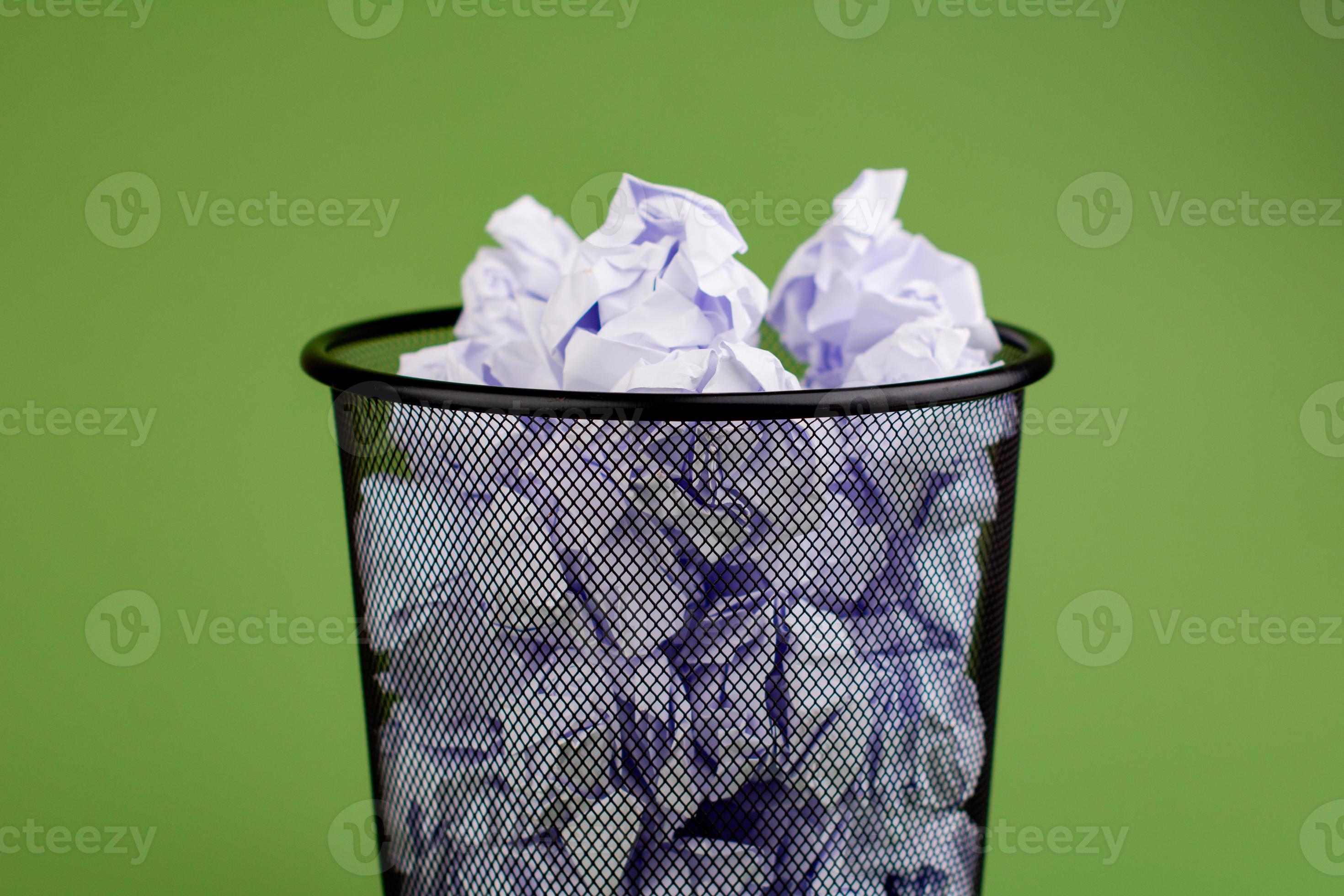 Garbage bin. Full waste paper bin. Garbage disposal. Throwing waste to