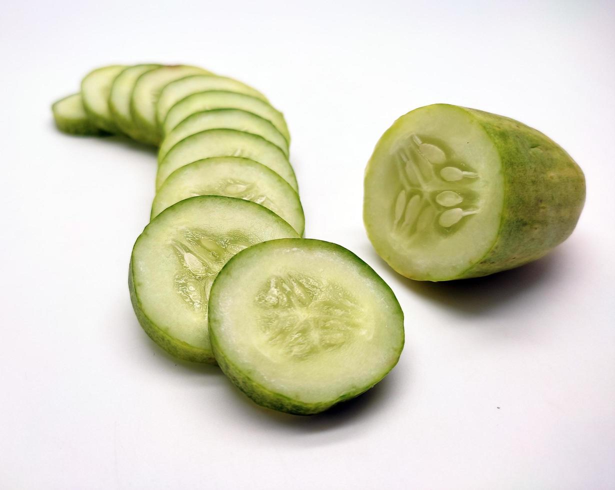 Slices of cucumbers isolated in white background photo