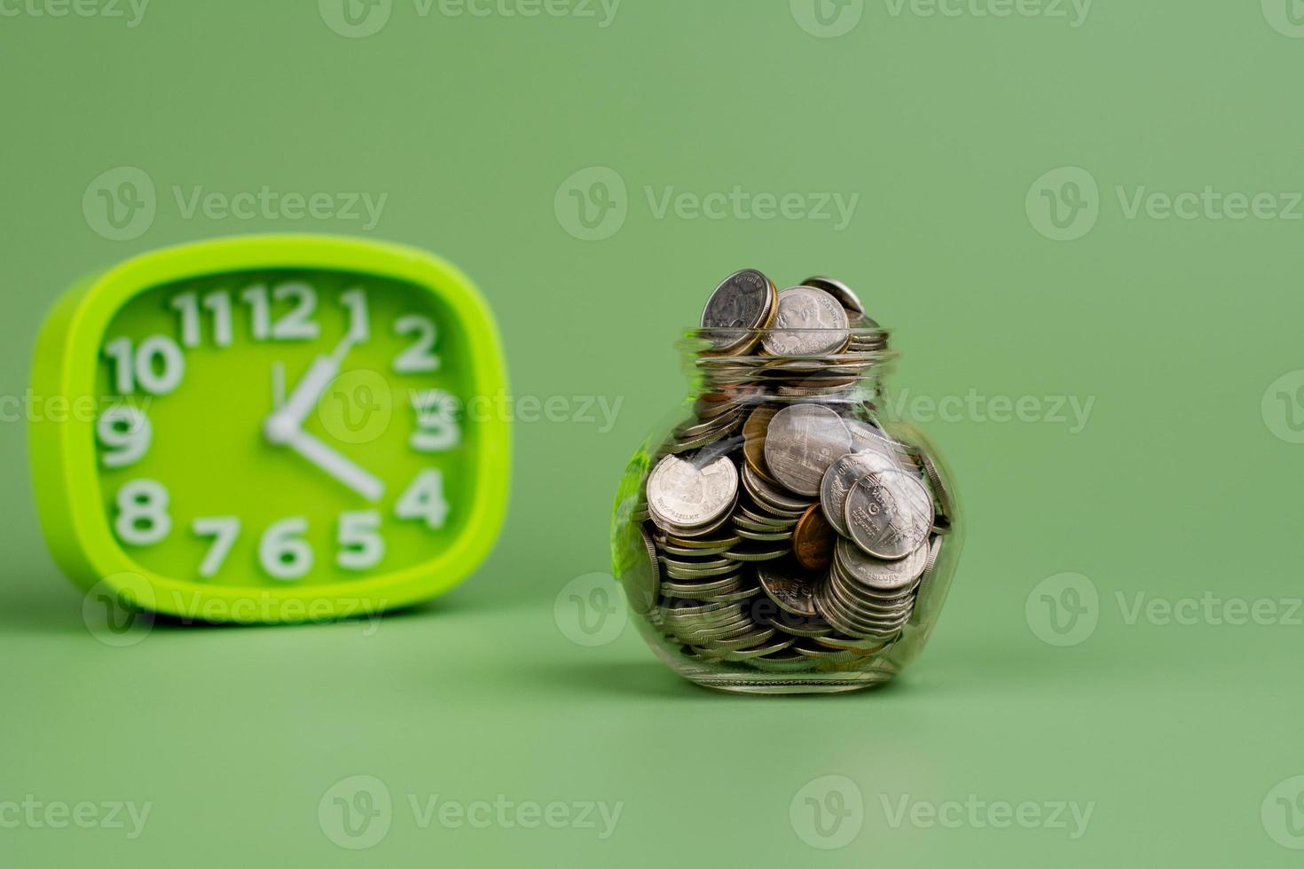 Savings in a glass bottle savings salary income from work savings concept photo