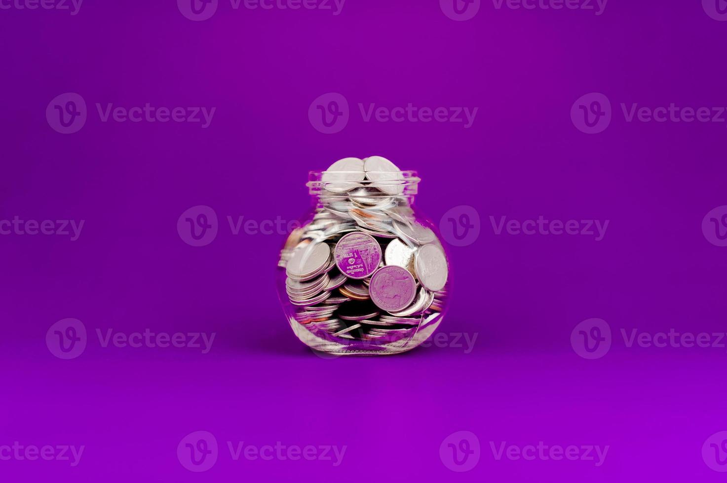 Savings in a glass bottle, savings, salary, income from work savings concept photo