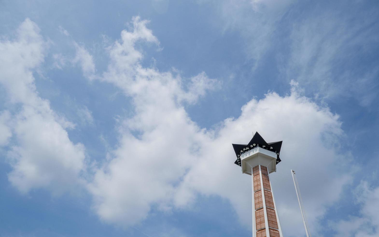 Main tower on Great agung mosque on the Semarang Central Java, when day time and blue sky. The photo is suitable to use for Ramadhan poster and Muslim content media.