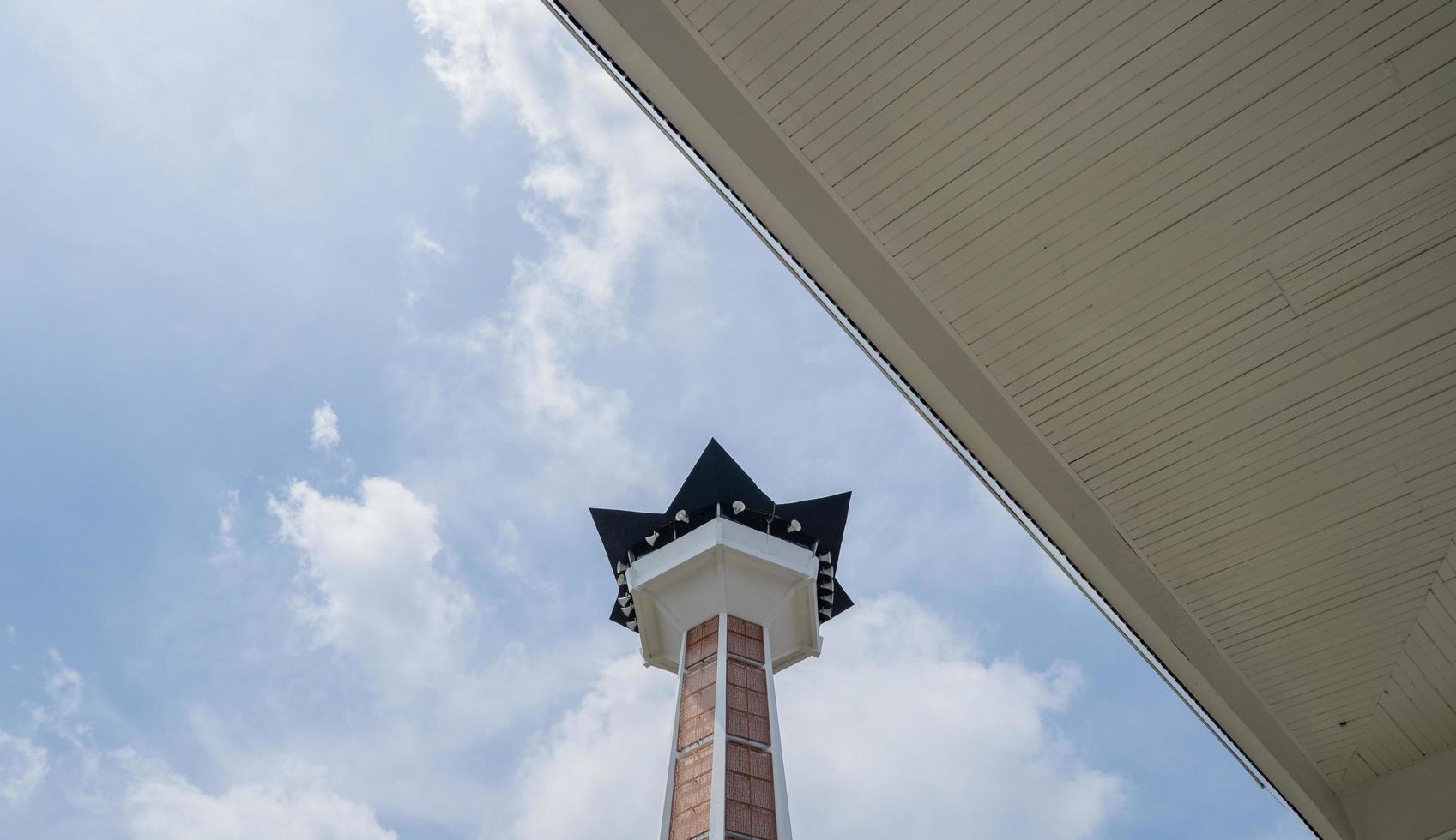 Main tower on Great agung mosque on the Semarang Central Java, when day time and blue sky. The photo is suitable to use for Ramadhan poster and Muslim content media.