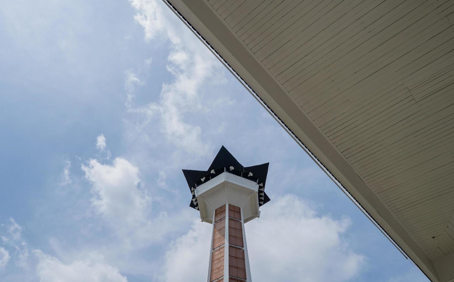 Main tower on Great agung mosque on the Semarang Central Java, when day time and blue sky. The photo is suitable to use for Ramadhan poster and Muslim content media.