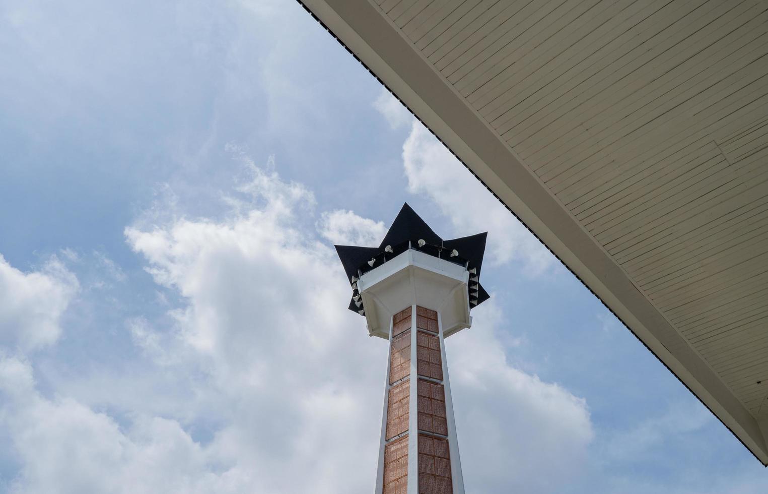 Main tower on Great agung mosque on the Semarang Central Java, when day time and blue sky. The photo is suitable to use for Ramadhan poster and Muslim content media.