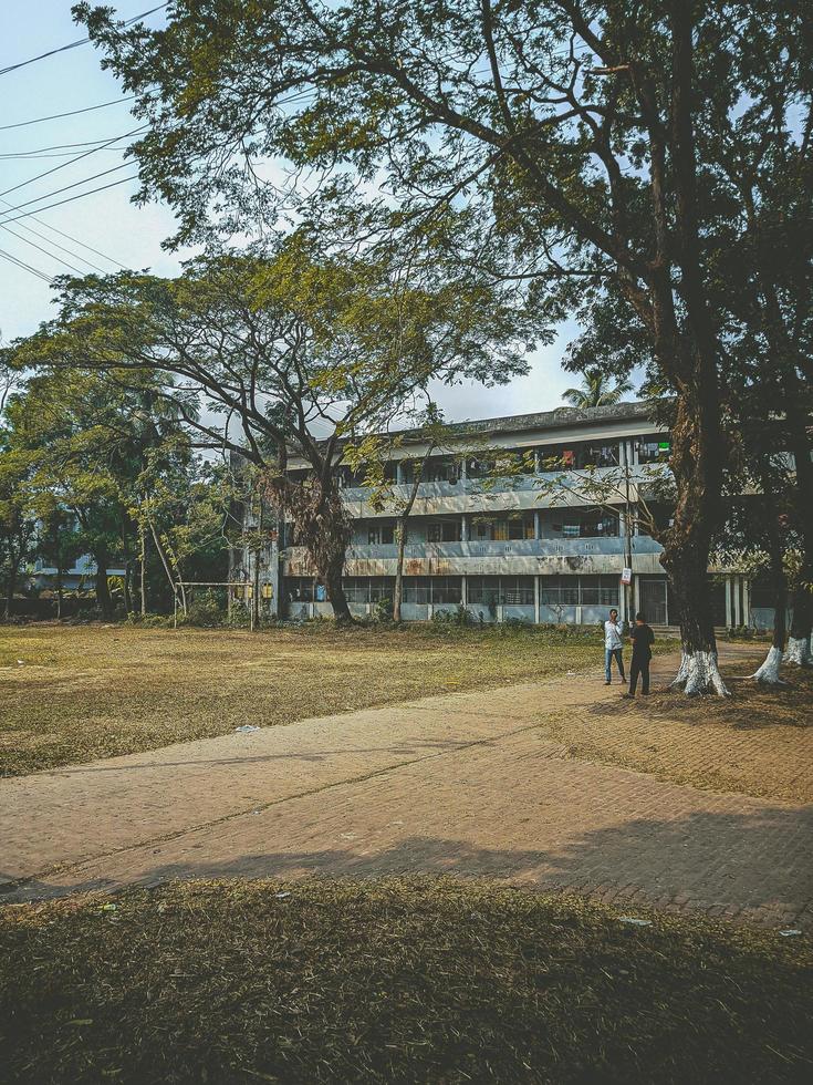 A group of people standing in front of a building photo