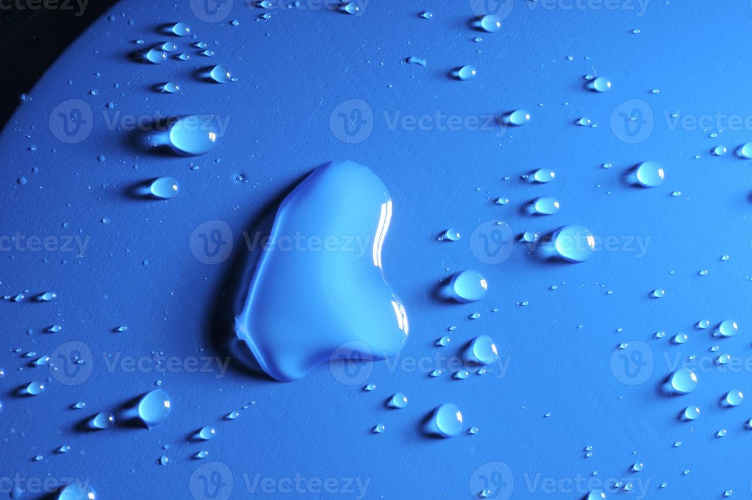 Droplets on blue background photo